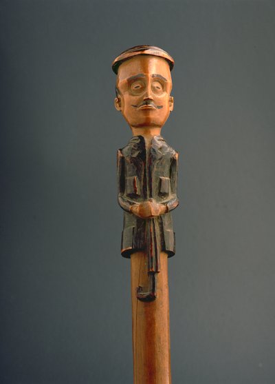 Stick with a Figure of a European Man Wearing a Cap and Holding an Umbrella, Ovimbundu, Angola, Late 19th Century by African